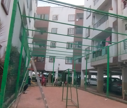 Cricket safety nets in Bangalore installed in a ground for player safety
