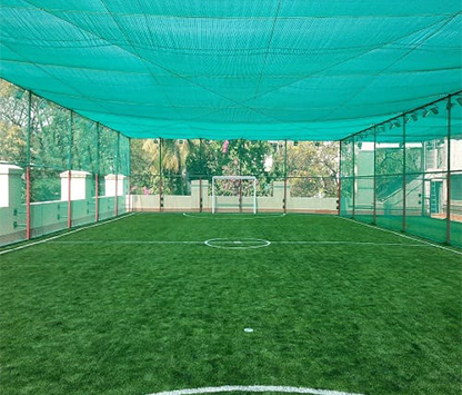 Cricket safety nets installed in a cricket ground in Bangalore for player safety
